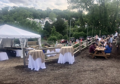 Are there any additional fees associated with using tables and chairs at the event venue?